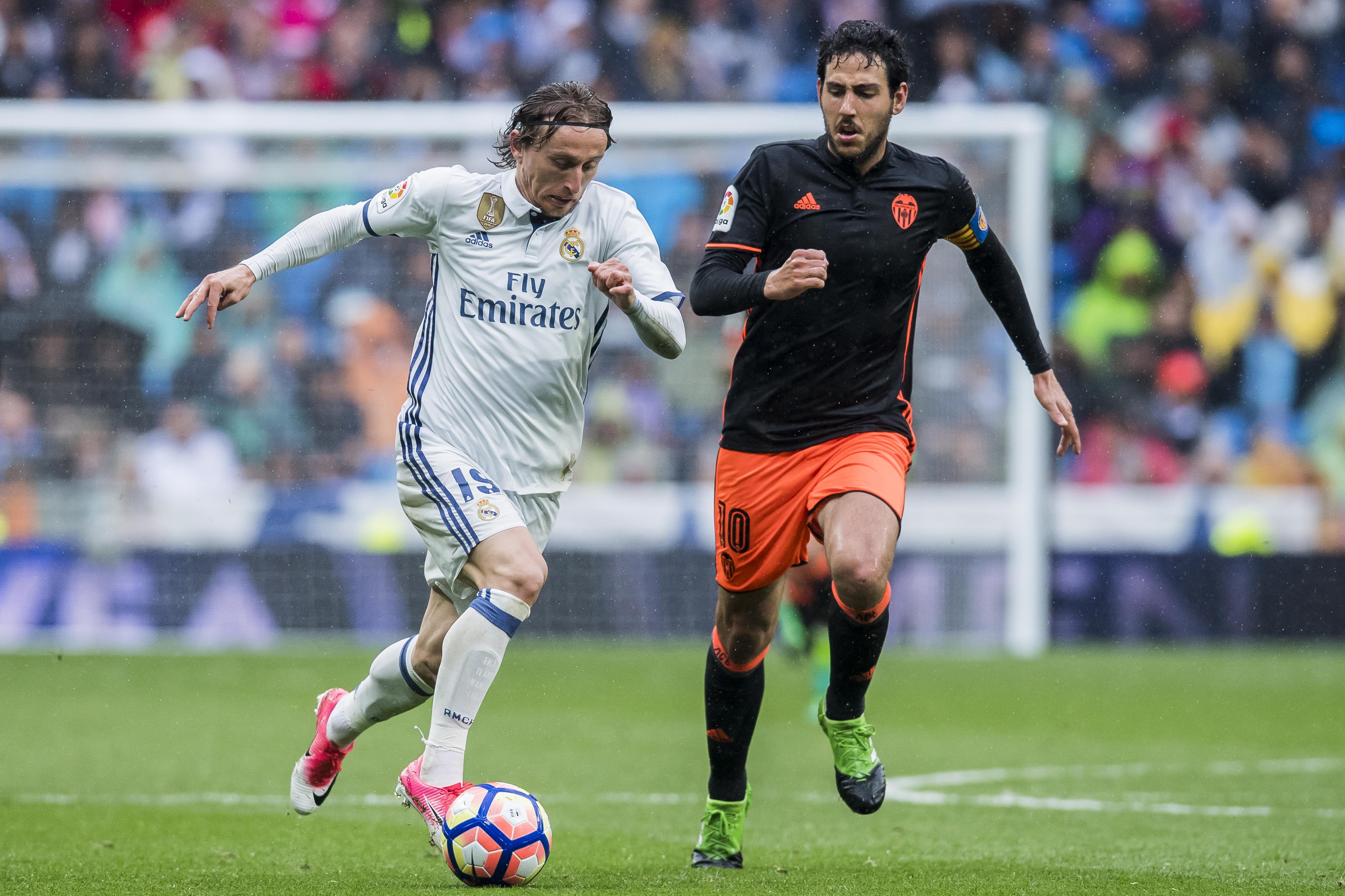 News Luka Modric on the ball for Genuine Madrid in a La Liga sport in opposition to Valencia in 2017.