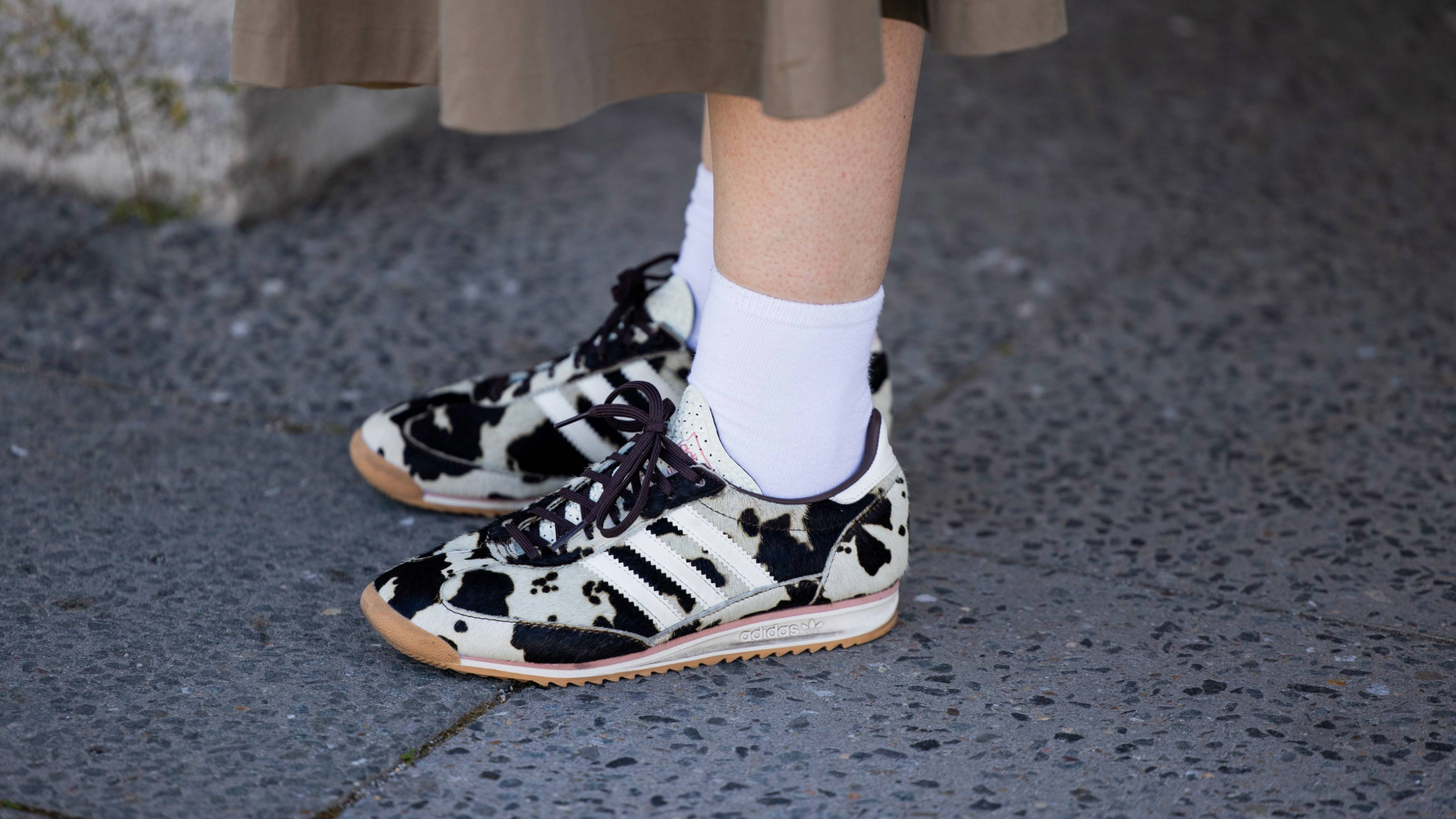 BERLIN, GERMANY - JULY 02: A guest wears Adidas sneaker with animal cow print outside Lueder during Berlin Fashion Week SS26 on July 02, 2025 in Berlin, Germany. (Photo by Christian Vierig/Getty Images)