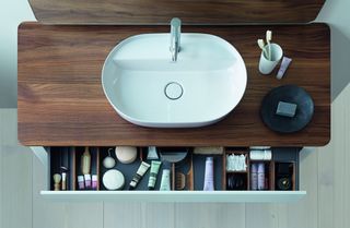 Bathroom sink organization in a vanity drawer