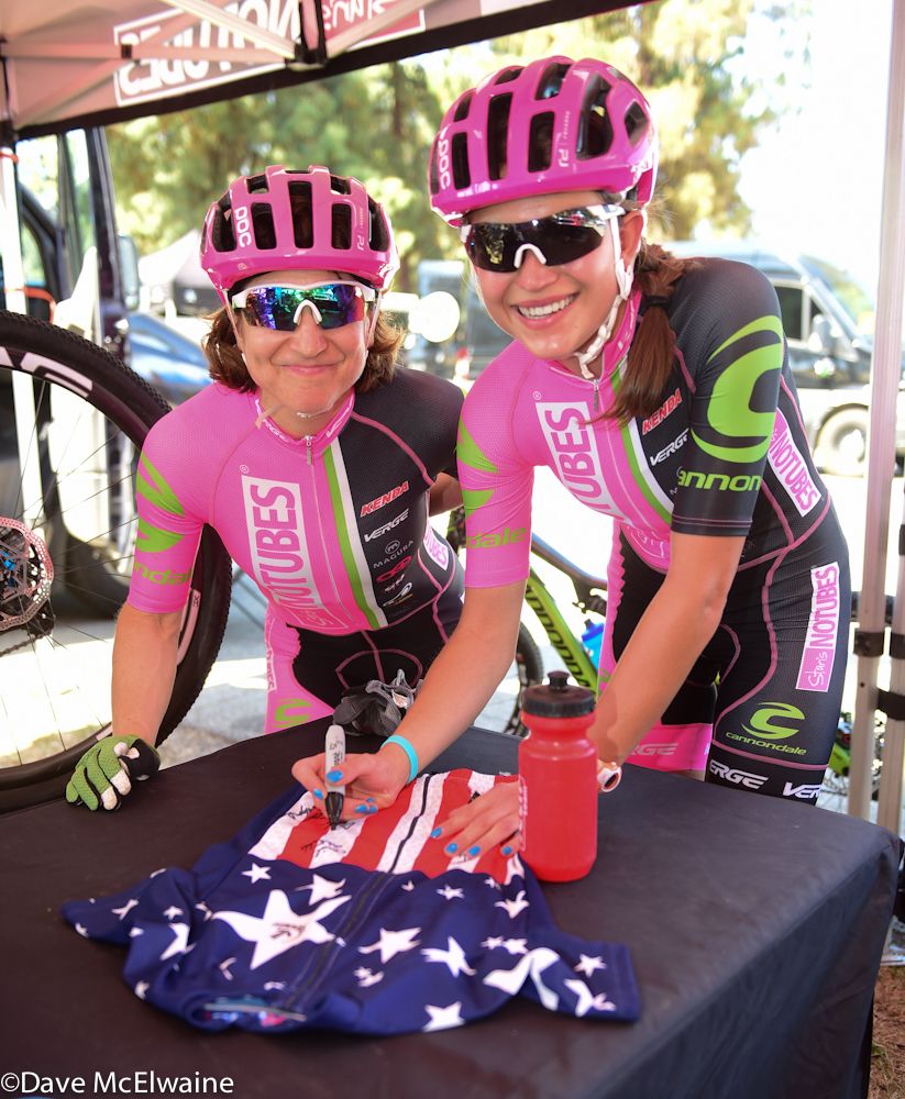 Nina Baum (L) and Emily Shields (R) sign a jersey prior to the race (Stans NoTubes)