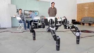 This view of NASA's RoboSimian robot shows its size as compared to human beings. The robot was built by engineers at NASA's Jet Propulsion Laboratory in Pasadena, Calif.