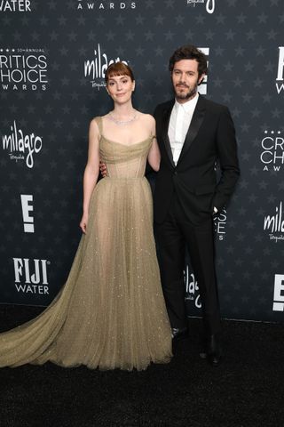 Leighton Meester wears a beige Dior gown on the red carpet.