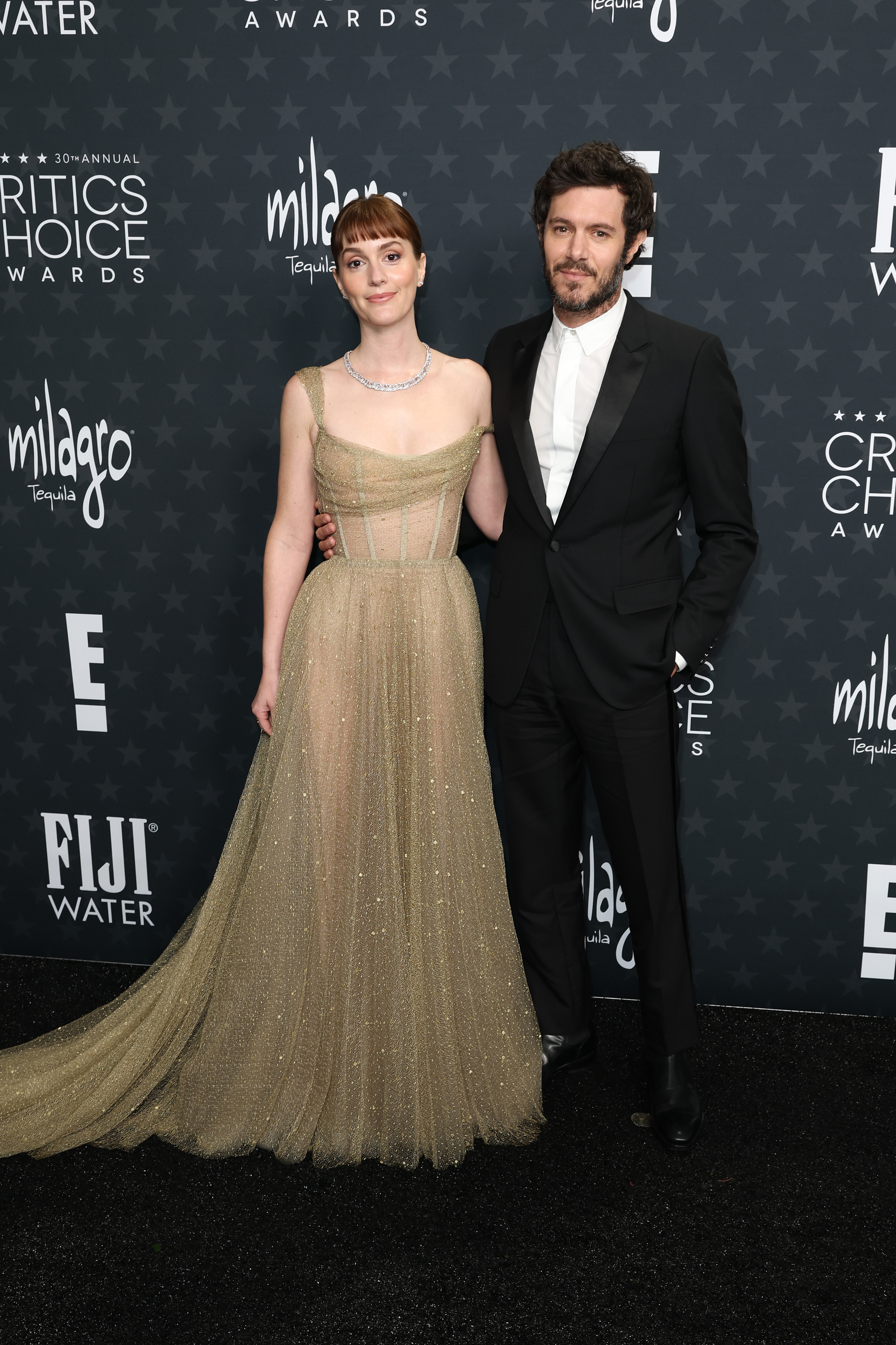 Leighton Meester wears a beige Dior gown on the red carpet.