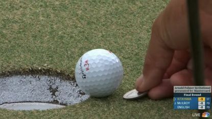 Screenshot of Kurt Kitayama marking his putt next to the hole