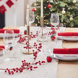 Christmas table decorations in a red theme with berries
