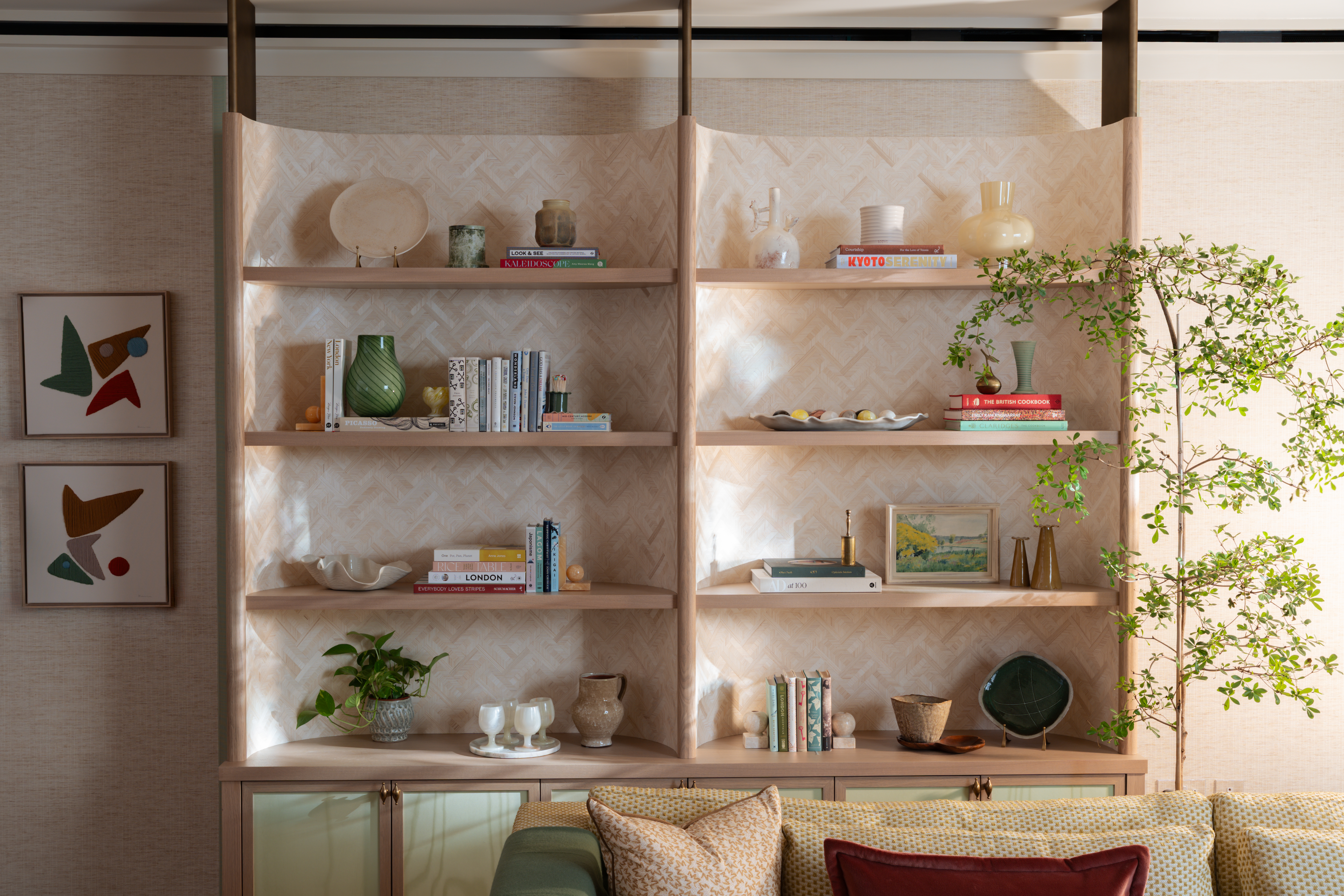 curved shelving full of objets like books and vases