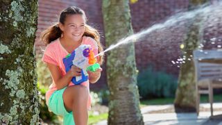 A water blaster being used to shoot water