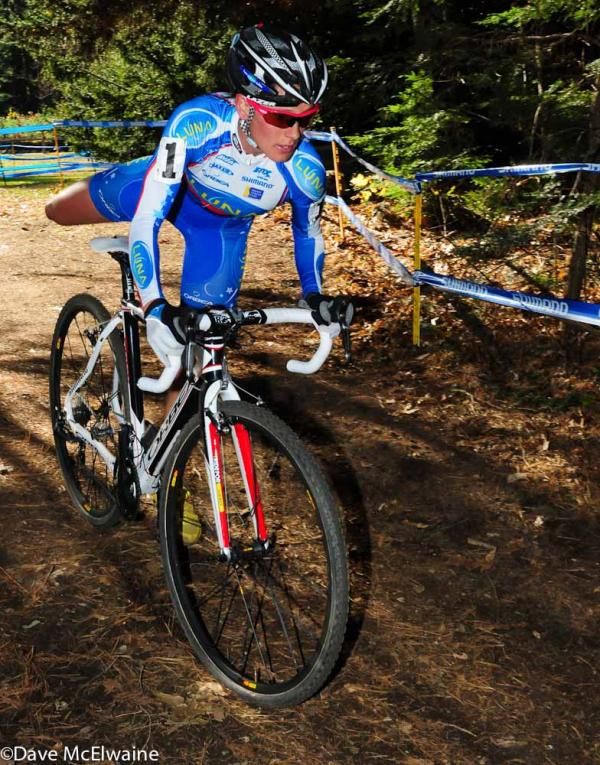 Katerina Nash (Luna Pro Team) dismounting for the run-up on the final lap.
