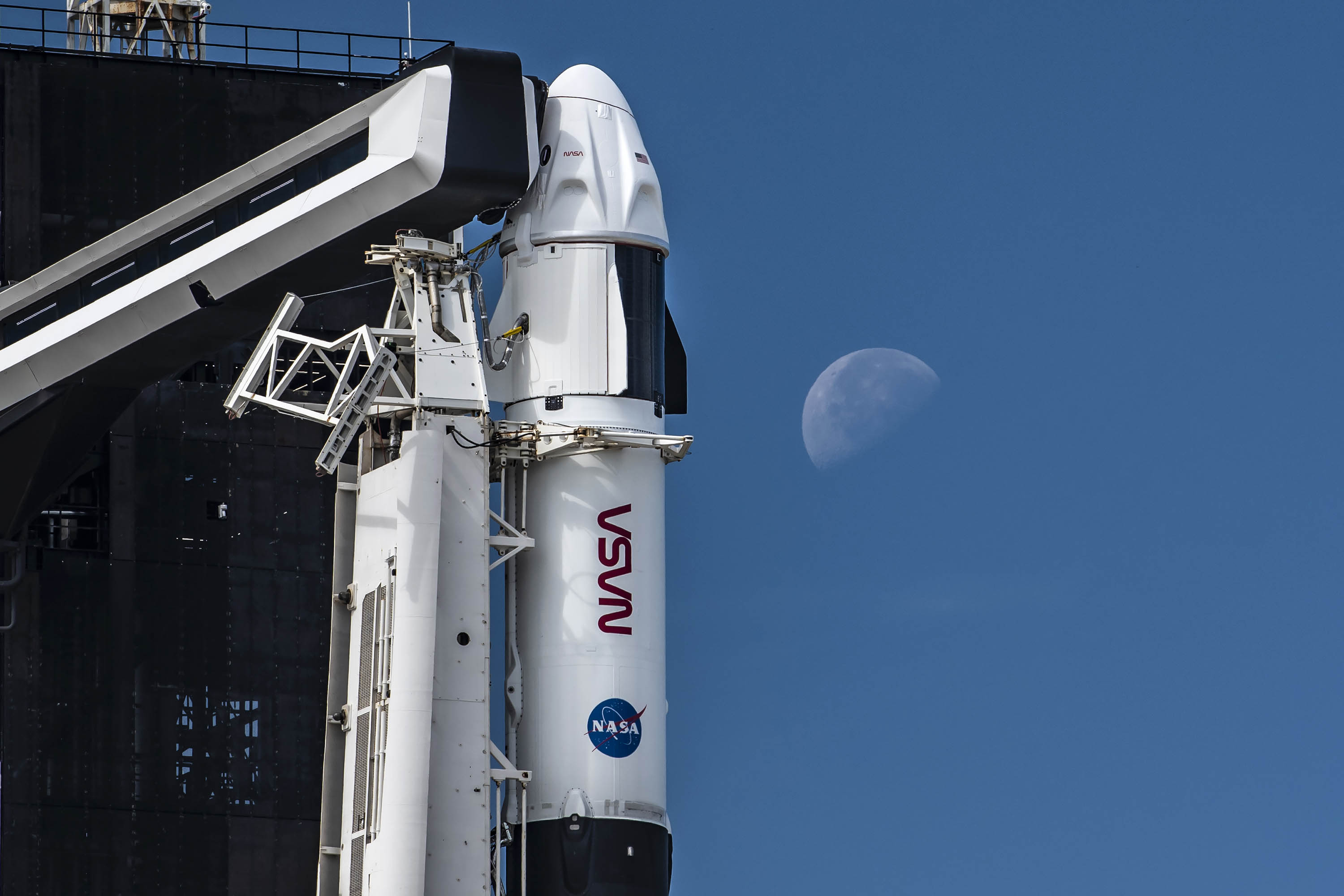 SpaceX's Crew Dragon Endurance is seen with the moon as it awaits a Nov. 3, 2021 launch from Pad 39A of NASA's Kennedy Space Center in Cape Canaveral, Florida.