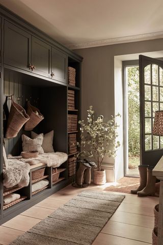 hallway with storage bench, cupboards and cubbies