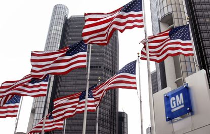 A GM sign and American flags