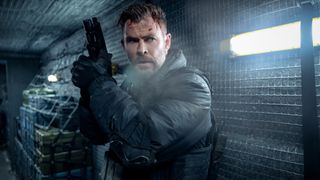 Tyler Rake (Chris Hemsworth) wields his weapon in between a fight in Extraction 2.