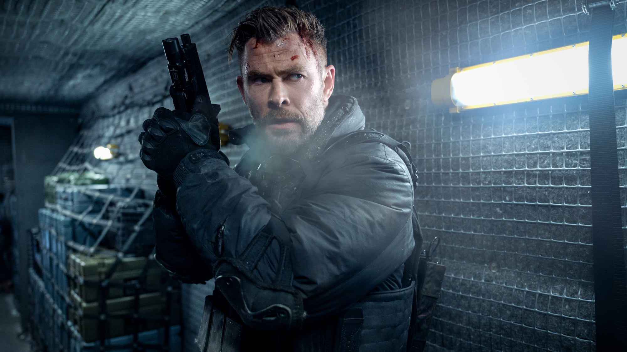 Tyler Rake (Chris Hemsworth) wields his weapon in between a fight in Extraction 2.