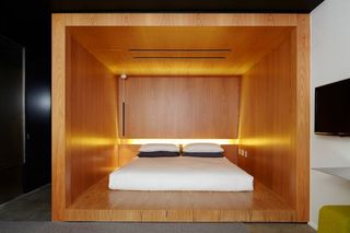Double bed in wooden box frame