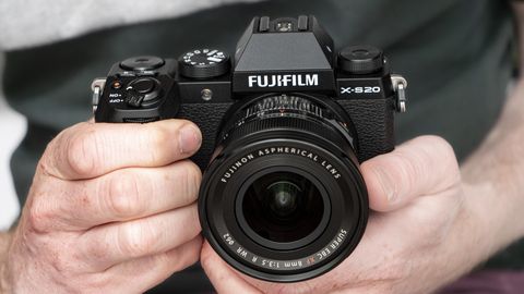 Fujifilm X-S20 camera in hand