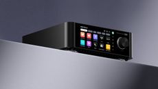 Eversolo Play amp and streamer shot from below on a grey surface against a gradient grey background