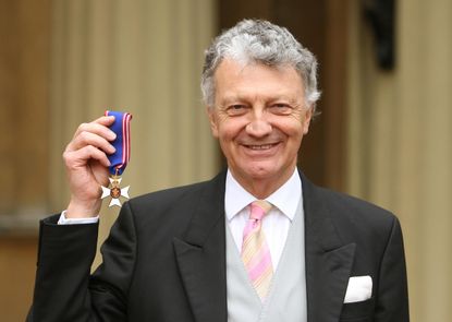 LONDON, UNITED KINGDOM - MARCH 10:Author William Shawcross with his Commander of the Royal Victorian Order (RVO) medal, presented by Britain's Queen Elizabeth II during an investiture ceremon