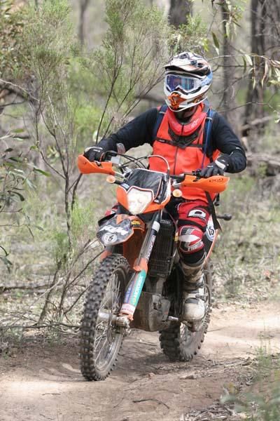 Lead motorbike escorting riders on sections of the course.