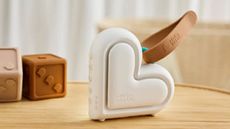 A cream, heart-shaped sleep machine from Love to Dream.