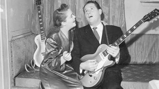 16th September 1952: guitarist Les Paul serenades his wife and singing partner Mary Ford