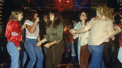 Groovy chicks dancing in a 1970s disco