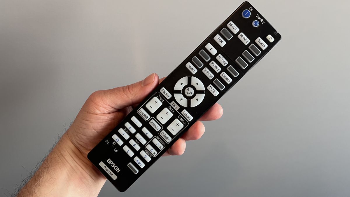 Epson QL7000 remote control held in hand