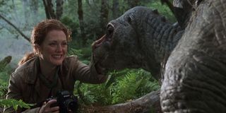 The Lost World: Jurassic Park Julianne Moore pets a baby Stegosaurus