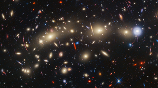 a smattering of galaxies seen as countless dots of light