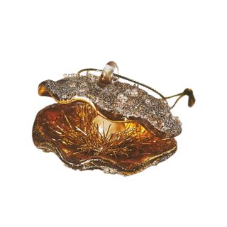 A gold clam Christmas ornament