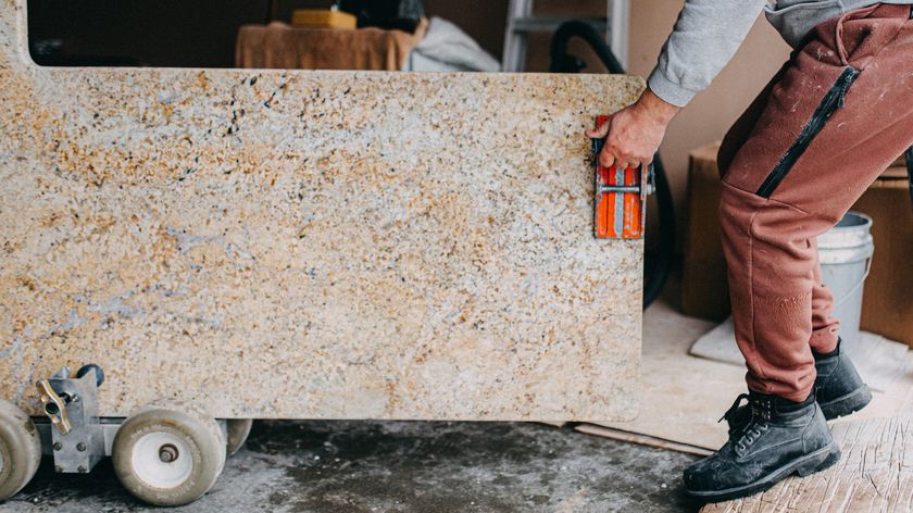 A granite worktop is delivered to a customer&#039;s home