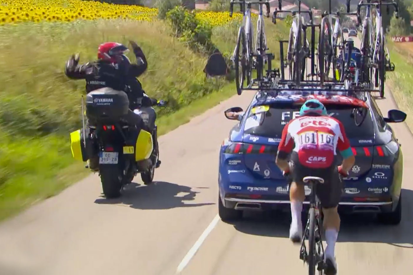 Ewan and the Alpecin-Deceuninck car at the 2022 Tour de France stage 13 with the UCI commissaire