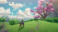 A deer-like creature walking up a hill to a blossom tree in Tales of Seikyu