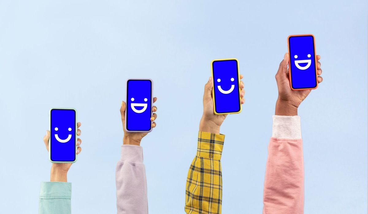 Four hands in shirt sleeves holding up smartphones displaying the Visible wireless carrier logo.