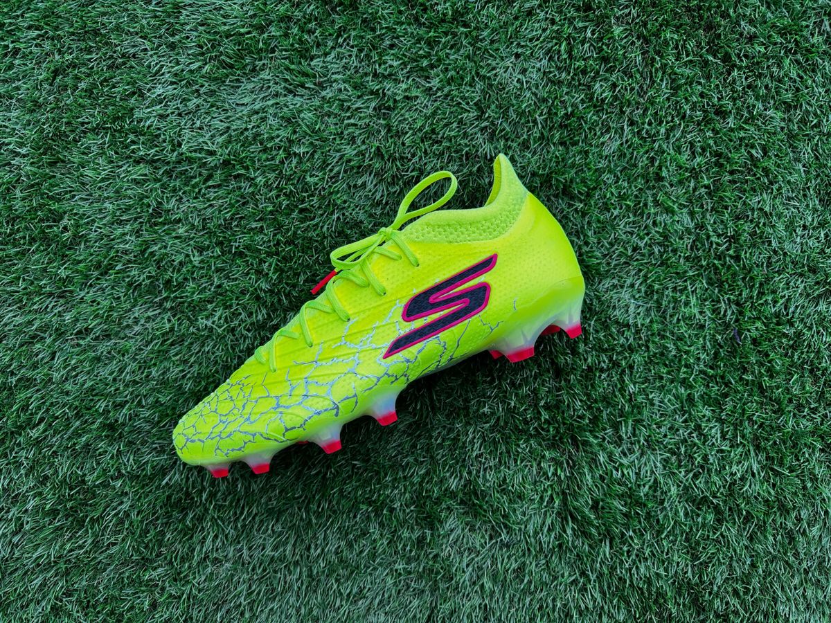 Skechers SKX 01 Elite football boots on a piece of astro turf ready for review