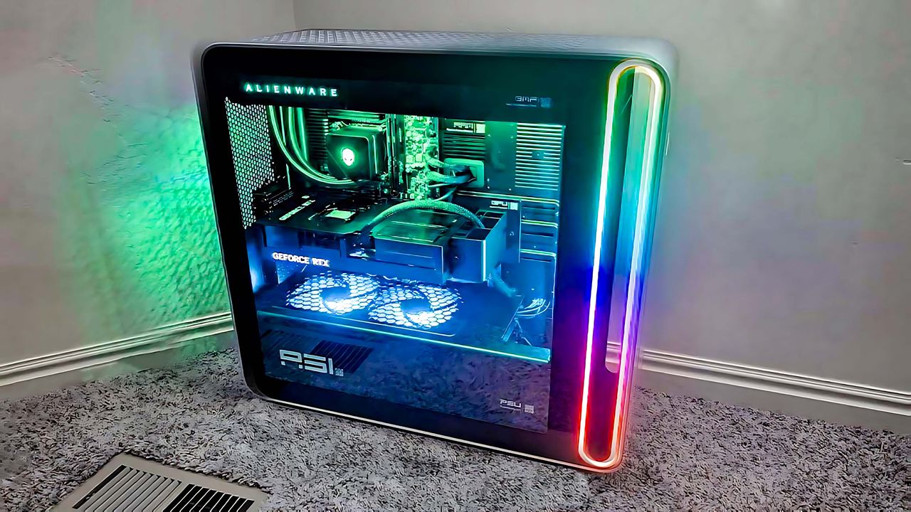 Alienware Area-51 Gaming Desktop (2025) on the floor and lit up with colorful RGB lighting.