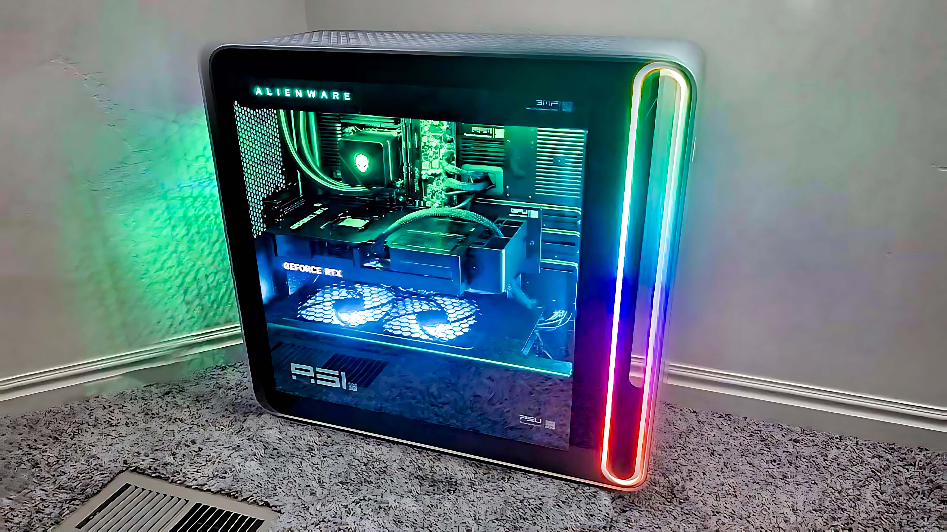 Alienware Area-51 Gaming Desktop (2025) on the floor and lit up with colorful RGB lighting.