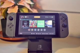 Nintendo Switch on home screen in a portable stand