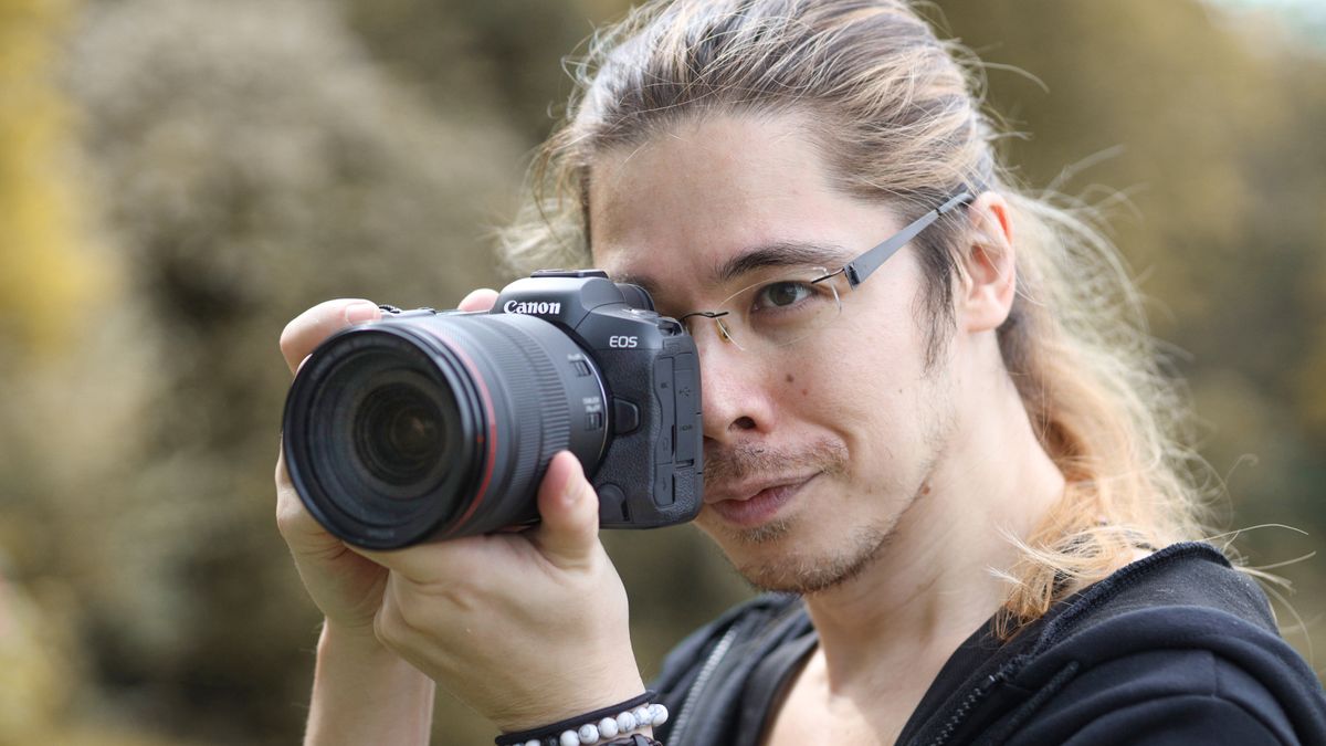 Photographer James Artaius holding a Canon camera