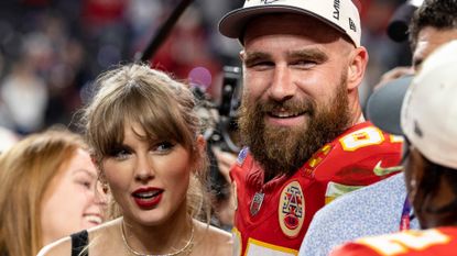 Taylor Swift has bangs and wears bright red lipstick while Travis Kelce wears a baseball cap following the NFL Super Bowl 58 football game between the San Francisco 49ers and the Kansas City Chiefs at Allegiant Stadium on February 11, 2024