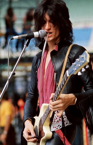 Joe Perry playing a double-cutaway Gibson Les Paul Junior