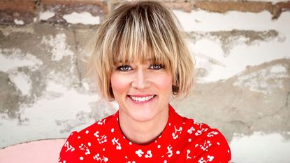 Edith Bowman smiling and wearing a black jacket