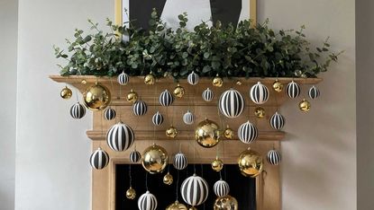 a living room with a festive garland and ornaments on a tray
