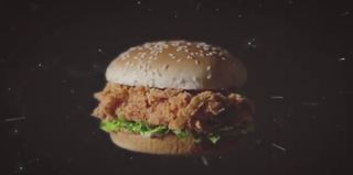 Marketing materials for KFC show the Zinger chicken sandwich in space. In reality, a Zinger sandwich is scheduled to fly to the stratosphere for four days on a World View Stratollite system.