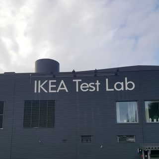 The a black building with large white letters on the side reading IKEA Test Lab