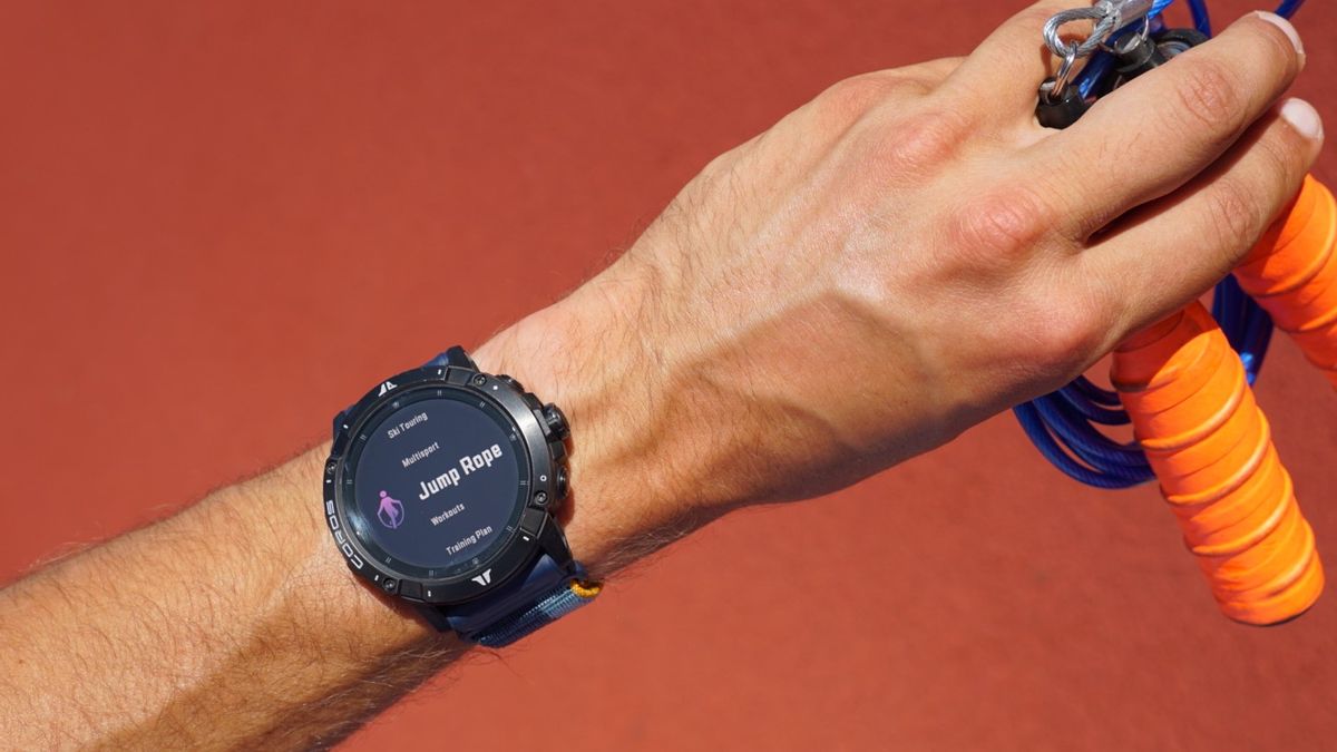 Man wearing Coros watch holding skipping rope