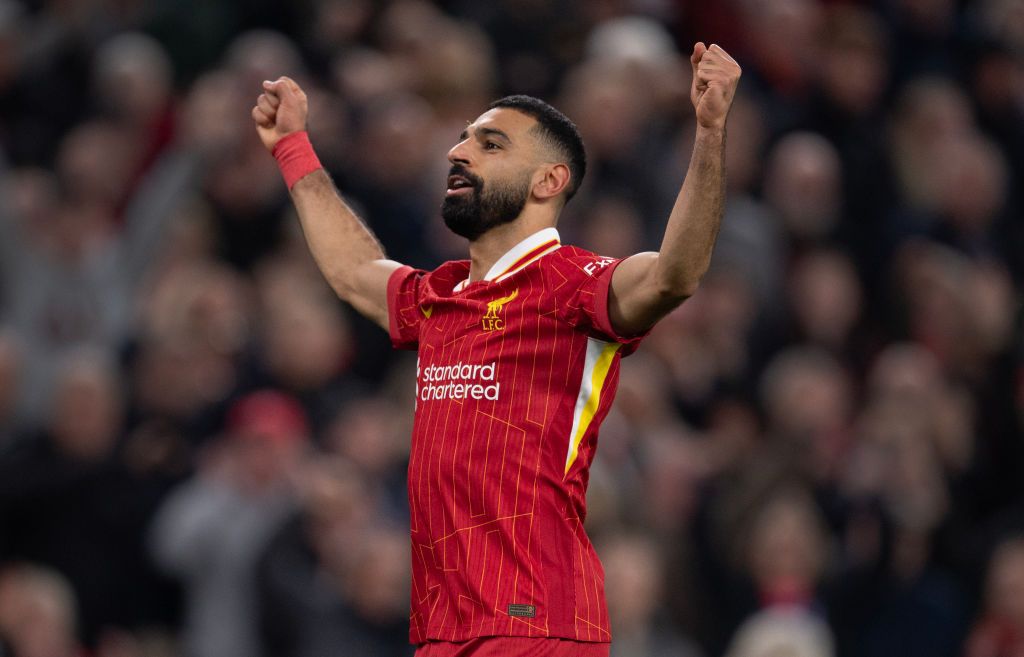 Mohamed Salah of Liverpool celebrates scoring the second goal during the Premier League match between Liverpool FC and Brighton &amp; Hove Albion FC at Anfield on November 2, 2024 in Liverpool, England.