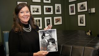Mary Badham holding an autographed photograph