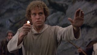 Peter MacNicol holds a magic necklace in Dragonslayer