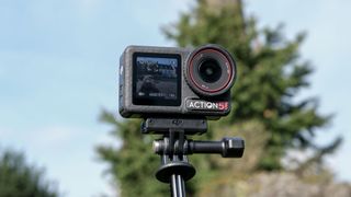 The DJI Osmo Action 5 Pro against an outdoors background