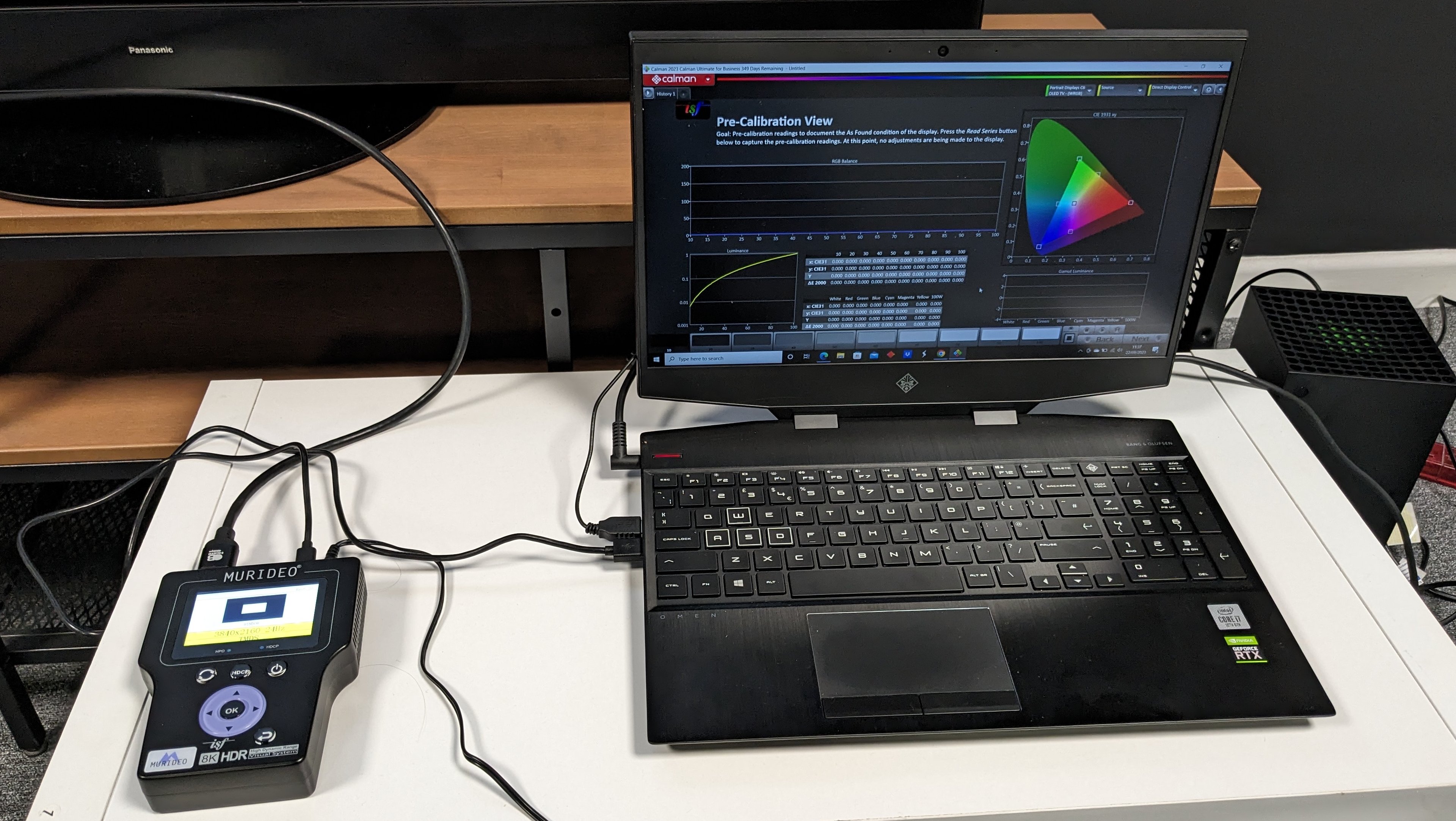 HP Omen laptop displaying Calman Portrait Displays calibration software hooked up to Murideo 8K test pattern generator
